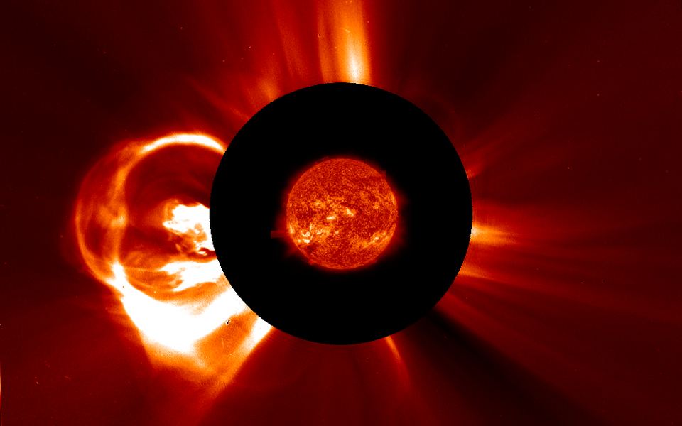 A coronal mass ejection leaving the Sun on August 31, 2012: a bright loop of plasma with a dark hollow and a bright core, seen by the SOHO coronagraph, with the Sun from SDO at the center