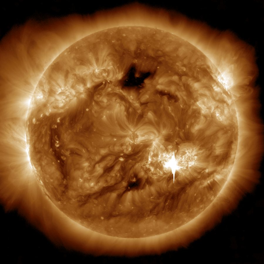 The Sun in extreme ultraviolet on May 9, 2024 with a brilliant white flare flashing in its lower right, bright enough to streak the camera